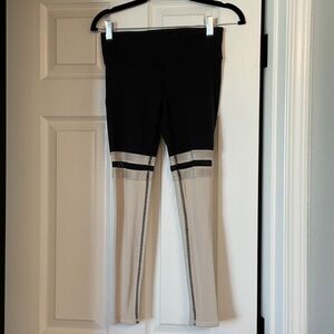 ALO Yoga Black and Cream Two-Tone Leggings with Knee Stripe Detail